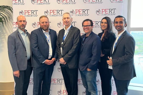 Dr. Rali (far right) with colleagues at a National PERT Consortium meeting.
