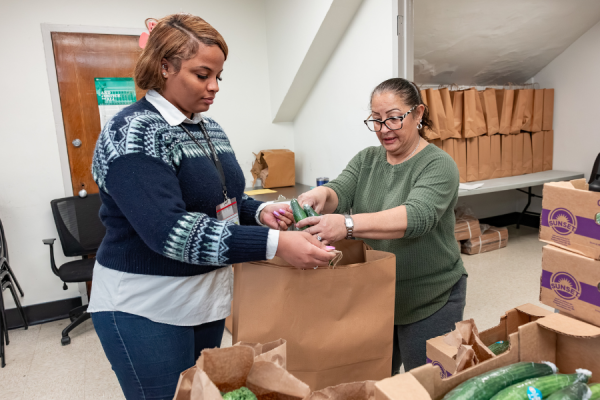 Williams and Garced prepare items for pickup.