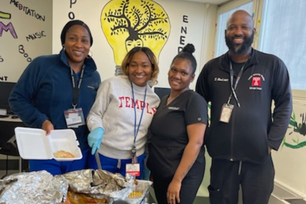 Episcopal Behavioral Health team members serving homecooked food on Thanksgiving.