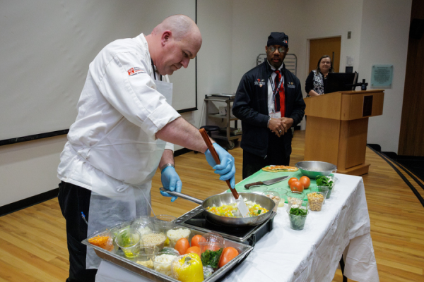 Chef Brett Heally serves up a delicious (and nutritious) creation during the live cooking demonstration.