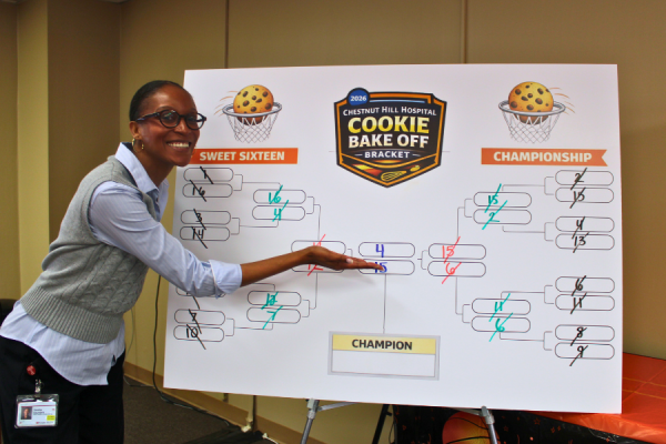 Champion Tausha Saunders with the Baking Contest bracket. 