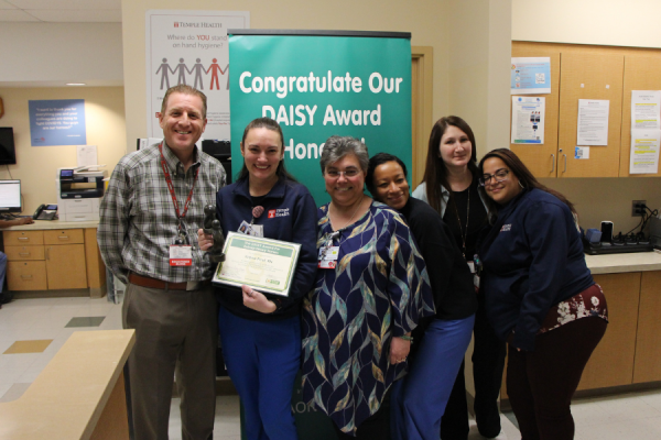 Nurse Iona Paul (second from left) celebrates her DAISY Award with her team.